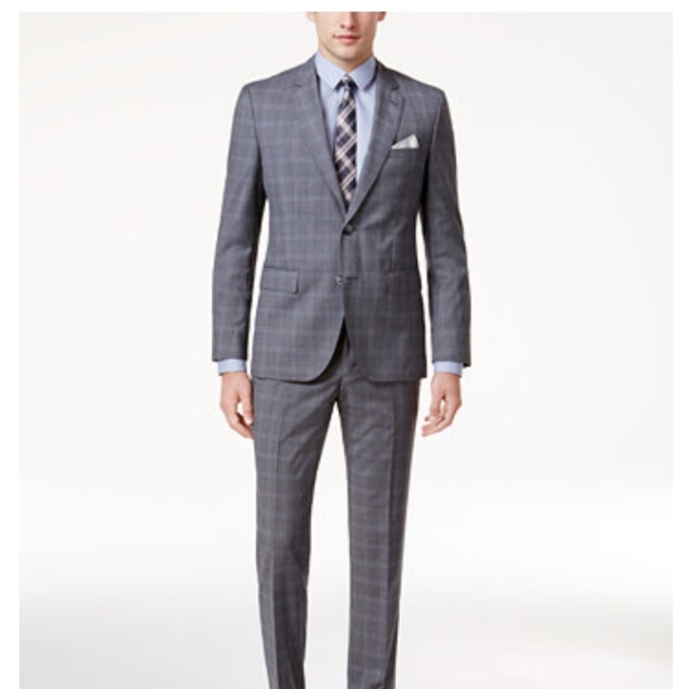 Brand new Hugo Boss suit with return sticker and a